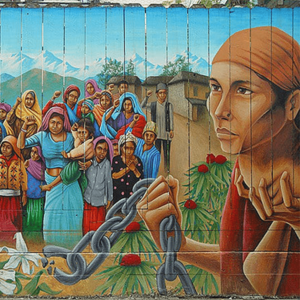 mural on fence of latinx people in pueblo