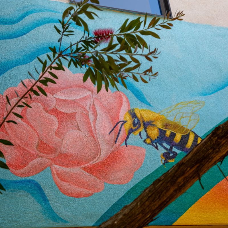 mural detail of bee and flower